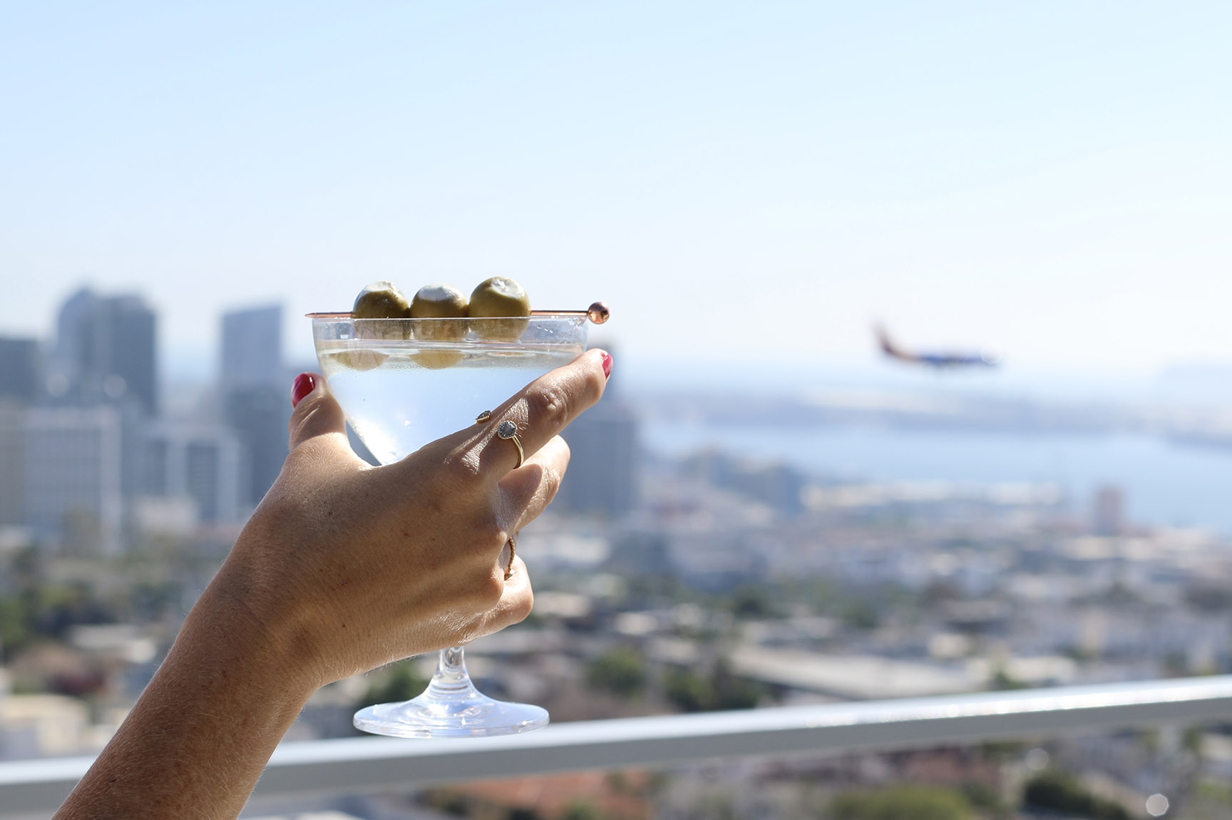 Martini raised to cheers downtown San Diego